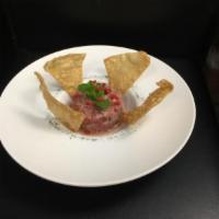 Spicy Tuna Tartare · Fresh ahi tuna with spicy sauce and crispy wonton.
