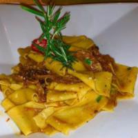 Tagliatelle alla Bolognese · Handmade green fettuccine served with our traditional Bolognese sauce.