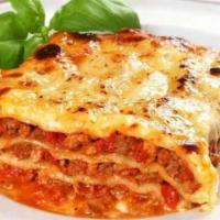 Lasagna Emiliana · Handmade layered pasta with Bolognese sauce, bechamel, mozzarella and Parmesan cheese.