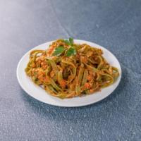 Fettuccine Verdi · Homemade spinach pasta, veal-beef-pork Bolognese and Grana Padano.