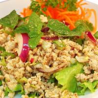 Larb Gai Salad · Minced chicken with red onion, chili, cilantro and lime vinaigrette, with a touch of rice po...