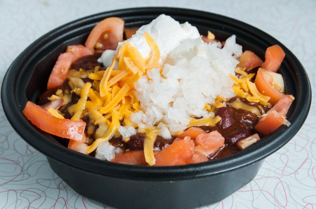 Rice Bowl · A hearty bowl of rice topped with your favorite chili (con carne or veggie), and topped with tomatoes, onions, and cheddar cheese.