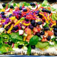 Greek Salad · Romaine lettuce, spinach, tomatoes, cucumbers, onions, bell peppers, olives, radishes and fe...
