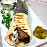 Gyro Sandwich Combo · Beef and lamb gyro topped with pickles, onions, tomatoes, fresh lettuce, tzatziki sauce and ...