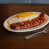 27. Chelo Kabob Koobideh · Two skewers of ground sirloin seasoned and mixed with grated onions and broiled on an open f...