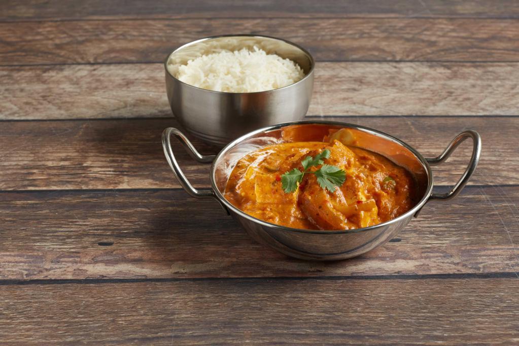Paneer Tikka Masala · Indian homemade cheese cooked in masala sauce with sliced onions, ginger, tomatoes, and bell peppers. Served with basmati rice.