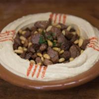 Hummus with Meat · Hummus dip, topped with beef, lamb and pine nuts.