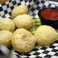 CHEESY Garlic Bites · House made dough bites with garlic butter and shredded cheese. Comes with red sauce.