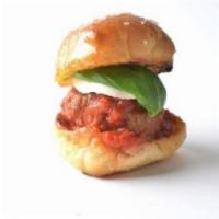 Meatball Sliders · 3 beef and pork meatballs served on a locally made bun topped with fresh mozzarella, fresh b...