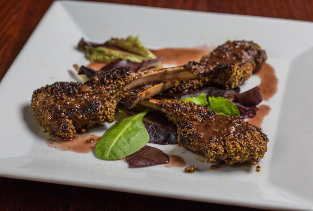 Pistachio Crusted Lamb Chops · 3-Pistachio crusted lamb chops seared to perfection finished with a port wine demi-glace drizzle.