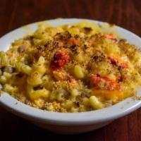 Truffle Lobster Mac and Cheese · A creamy blend of imported brie, smoked gouda, provolone and parmesan cheese infused with wh...