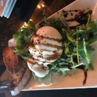 Truffle Infused Burrata · Over a bed of baby arugula, finished with a drizzle of balsamic reduction and white truffle ...