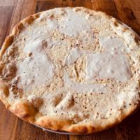 Classic White Pie · Roasted Garlic Infused Ricotta, House Made Fresh Mozzarella & Grated Parmesan