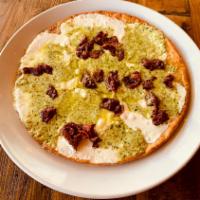 10” Cauliflower Pesto Pie · A Cauliflower Pizza Crust Topped with House Made Fresh Mozzarella and a Creamy Basil Pesto F...