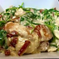 Chicken Fettuccini Alfredo · Sauteed chicken breast, wilted spinach and sweet sun-dried tomatoes tossed with fresh fettuc...
