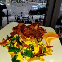 Vegan Scrambled · Organic Tofu with roasted peppers, sun-dried tomatoes, Portobello mushrooms, red onions and ...