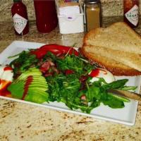 California Avocado Toast · Fresh organic arugula, avocado, sliced tomatoes over wheat toast. Served with home-style pot...