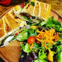 Grilled Eggplant Press Panini · Sweet grilled eggplant with roasted peppers, fresh spinach, sun-dried tomatoes and fresh moz...