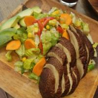 Grilled Portobello Salad · Romaine lettuce, grilled scallions, corn, carrots, capers and avocado with our house Tuscan ...