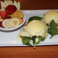 Eggs Florentine · English muffin, spinach, tomato and poached eggs. Topped with Hollandaise sauce. Served with...