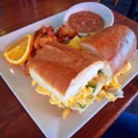 Egg Sandwich · Scrambled eggs, bacon or sausage, melted together with Jack and cheddar cheese. Served on a ...