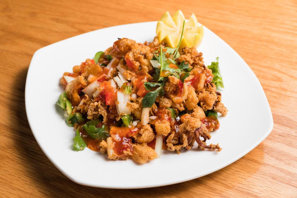 Spicy Calamari Plate · Seasoned calamari with peppers, onions, and cilantro drizzled with sweet chili sauce.