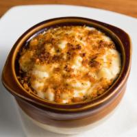 Baked Mac and Cheese Plate · Housemade four cheese sauce with herbed crusted topping.