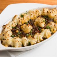 Baked Shepherd's Pie · meaty savory comfort classic dish made with chopped beef , baked in a brown sauce with carro...