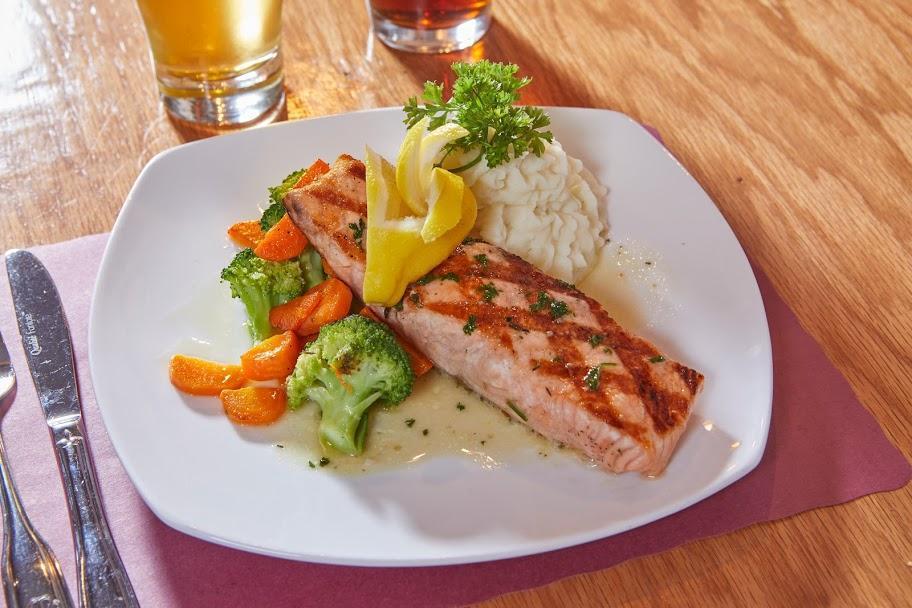 Grilled Norwegian Salmon Filet · char grilled to order salmon filet served with a pinot grigio, lemon & herb sauce and served with your choice of starch and vegetables.