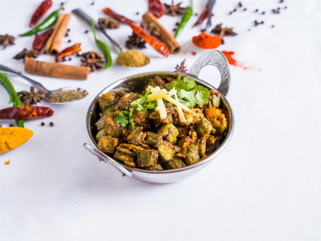 Bhindi Masala · Baby okra sauteed with onions, tomatoes and spices.