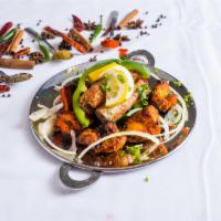 Mix Grill · Chicken tikka, shrimp tandoori malai and seekh kebab.