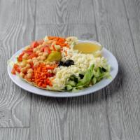 Chopped Italian Garden Salad · Iceberg, romaine lettuce, tomato, carrots, garbanzo beans, cucumbers, mozzarella, pepperonci...