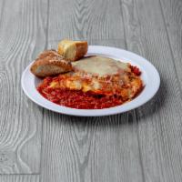 Luciana's Lasagna · Traditional style with layers of meat, ricotta, mozzarella with marinara sauce and mozzarell...