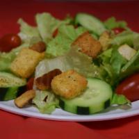 Garden Salad · Green leaf lettuce, cherry tomatoes, cucumber and croutons with your choice of dressing.