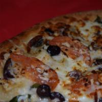 Greek Pizza · Olive oil, oregano, garlic, onions, feta, Kalamata olives and fresh tomatoes.