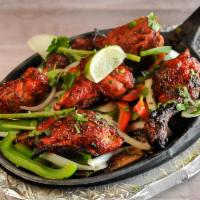 Tandoori Chicken (6) · Chicken marinated overnight in yogurt, fresh spices and lemon juices. Barbecued in tandoor a...