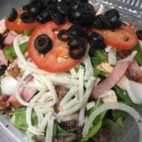 Chef Salad · Our house salad with Canadian bacon, salami, bacon & shredded mozzarella. Dressing on the si...