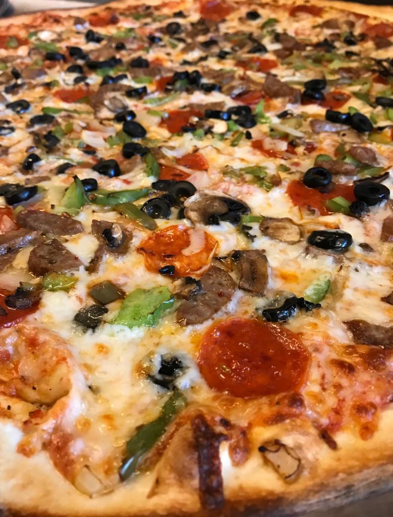 The Works Pizza · Pepperoni, sausage, green peppers, onions, mushrooms, black olives, garlic.