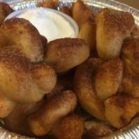 Cinnamon Knots · Served with icing.