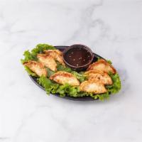 Pork Potstickers · Deep-fried pork and vegetables dumplings served with sweet and sour sauce.