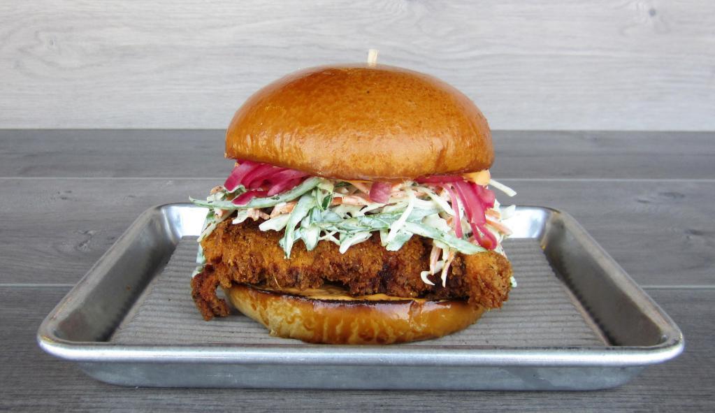 El Jefe · Fried chicken, carnita-spice rub, cabbage-jalapeno slaw, chipotle mayo, pickled red onions.