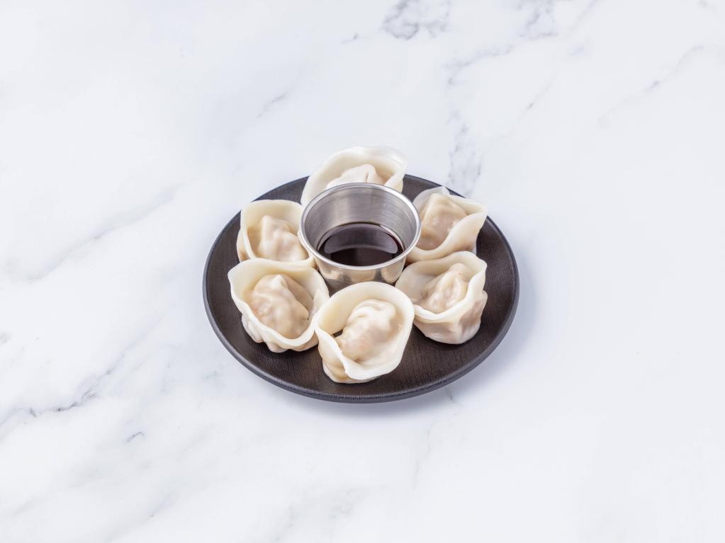Steamed Dumplings · Steamed homemade dumplings filled with carrots, scallions, zucchini, and choice of beef or tofu.