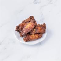 Crispy Wings · Deep-fried chicken wings glazed with onion soy sauce. Gluten free.