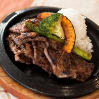 Kitchen Grilled Kalbi · Soy marinated short ribs served with grilled onion. Prepared in the kitchen and served with ...