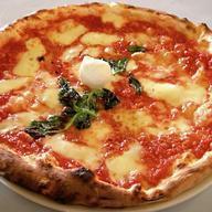 Pizza Margherita · Tomatoes, mozzarella and basil.