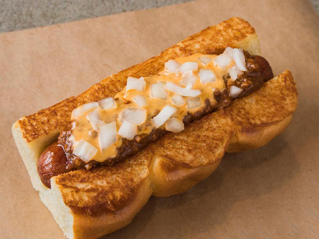 Chili Idol Dog · Haus chili, cheese sauce, and white onions. Served on King's Hawaiian roll.