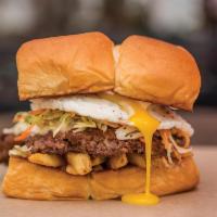 The Freiburger · White American cheese, fries, Haus slaw, fried egg, and mayo. Hormone and antibiotic free be...
