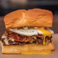 The Hangover  · White American cheese, smoked bacon, haus chili, fried egg, and mayo. Served on King's Hawai...