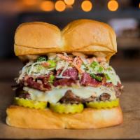 The Mensch  · White American cheese, pickles, pastrami, haus slaw, and secret sauce. Served on King's Hawa...