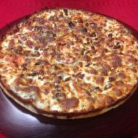 Mediterranean Magic Pizza · Tomatoes, fresh garlic, basil, sweet onion, black olives, mozzarella, and feta cheese. Veget...